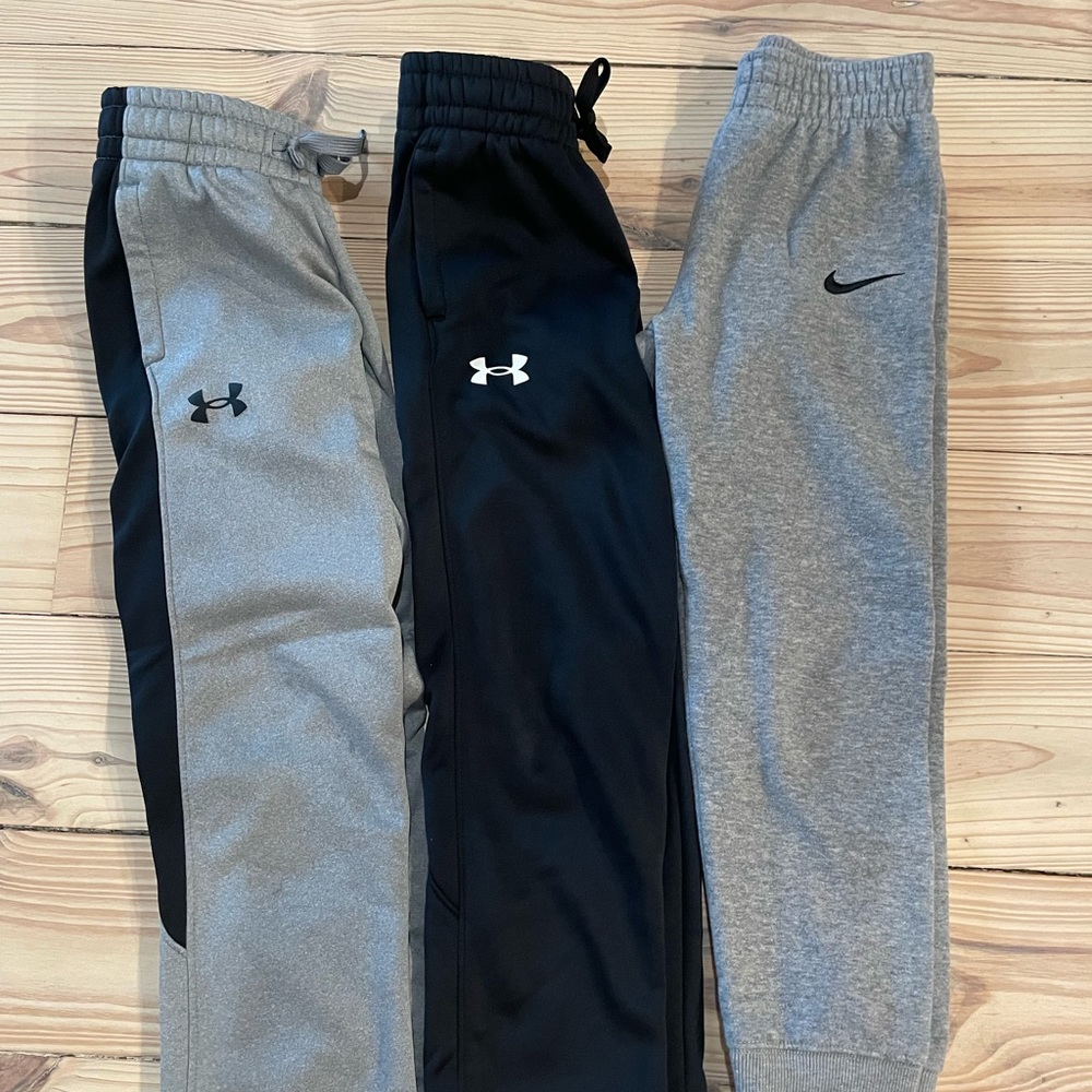 Boys under armour and Nike sweatpants